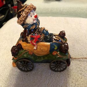 Snowman in old time car